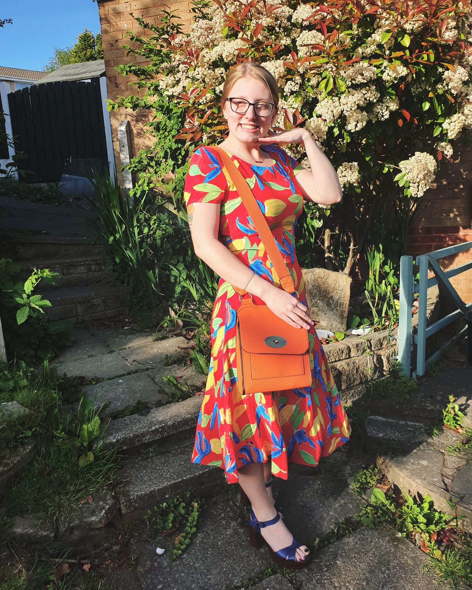 A picture of Lia wearing a bright red dress